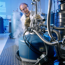Ultraprecise electrical measurements require extremely stable temperature, humidity, and vibration control. In this laboratory within the NIST Advanced Measurement Laboratory physicist Rand Elmquist fills a cryogenic chamber with liquid helium in preparation for measuring the international standard for electrical resistance—the quantum Hall effect.  Copyright Robert Rathe