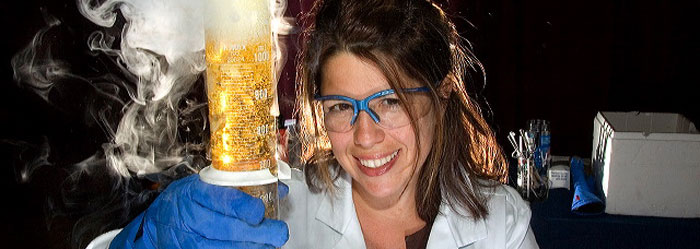 Photo of scientist with beaker