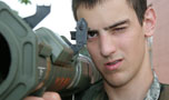 Photo of Army ROTC Cadets firing an M-16 rifle