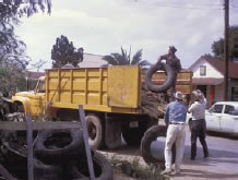 Workers loading tires into a truck