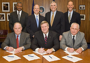 OSHA's Assistant Secretary, Edwin G. Foulke, Jr. and members of The Roadway Work Zone Safety and Health Partners sign national Alliance agreement on January 25, 2007.