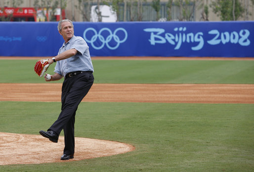 President George W. Bush throws out the first pitch at the Men’s Olympic Baseball practice with Team USA and Team China, Monday, Aug. 11, 2008. White House Photo by Eric Draper White House photo by Eric Draper
