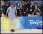 President George W. Bush is the center of attention as he watches U.S. beach volleyball practice Saturday, Aug. 9, 2008, at Chaoyang Park in Beijing. White House photo by Eric Draper