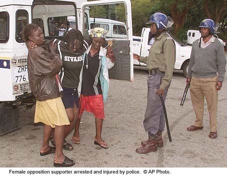 Female opposition supporter arrested and injured by police.