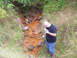 Man conducting water quality monitoring.