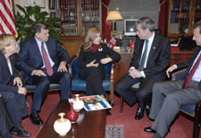 Secretary Gutierrez meets with Elsa Morejon, and members of the press.  Click for larger image.