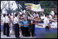 Crowds cheer and wave flags as the motorcade of President George W. Bush and Mrs. Laura Bush passes Tuesday, Aug. 5, 2008, following President Bush's arrival to Seoul. White House photo by Eric Draper