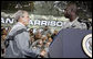 President George W. Bush shakes hands with U.S. Army Cpl. Victor Berlus before delivering his remarks to the U.S. Army Garrison-Yongsan Wednesday, August 6, 2008, in Seoul, South Korea. White House photo by Eric Draper