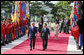 President George W. Bush and South Korean President President Lee Myung-bak, joined by Mrs. Laura Bush, Mrs. Kim Yoon-ok, and daughter Ms. Barbara Bush, participate in a welcoming ceremony in the Grand Garden of the Blue House Wednesday, Aug. 6, 2008, in Seoul. White House photo by Eric Draper