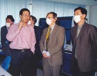 Dr. Lipkin, center, at the Chinese Academy of Military Medicine during the 2003 SARS outbreak. To the left is molecular biologist Ruifu Tang; at the far left is Chen Zhu, current Chinese Minister of Health. On the right is an interpreter. (Credit: Ian Lipkin)