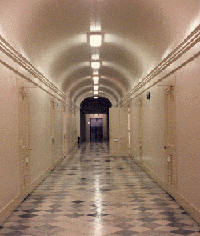 color photo taken down a long barrel-vaulted corridor