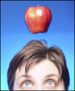 Woman with an apple above her head