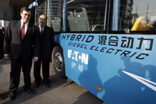 Under Secretary Lavin next to Hybrid Diesel Electric Bus in Beijing