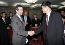 Assistant Secretary David Bohigian shakes hands with Chinese official