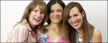 Photo: Three smiling women.