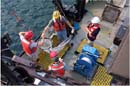 photo: Scientists prepare to deploy plankton sampling net