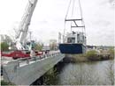 photo:  The R/V Mudpuppy gets launched from a bridge over the Ottawa River