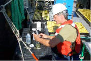photo: Fred Luckey, USEPA Region 2 scientist processes samples collected in the Lake Ontario LOLA Study