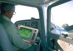 A sketchmapper operating the software via a touchscreen; USDA Forest Service photo.