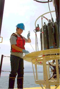 photo: Great Lakes National Program Office's intern, Christyanne Melendez, prepares water sampler for deployment in Lake Erie dissolved oxygen survey