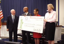 Officials holding check. Pictured (L-R):  Chairman of the House Transportation and Infrastructure Committee James L. Oberstar; Washington, D.C. Mayor Adrian Fenty; U.S. Congresswoman Eleanor Holmes Norton; Director of Legislative and Intergovernmental Affairs Patty Sheetz. Click here for large picture.