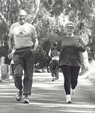 Photo of a man and a woman race walking. - Click to enlarge in new window.