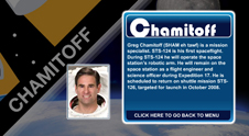 A close-up view of the name Chamitoff on the STS-124 mission patch and a photo of Greg Chamitoff