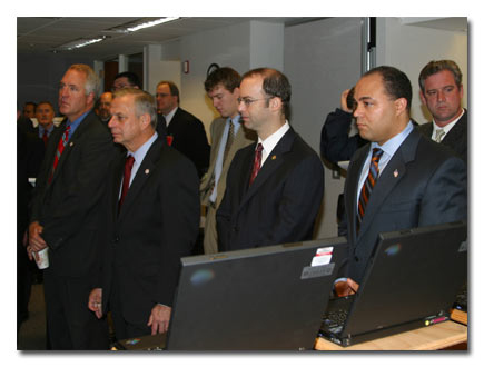 Listening to a presentation are (from left) Congressman Shimkus, Congressman Green, Commisssioner Adelstein and Chairman Powell.