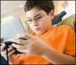 photo of boy playing video games