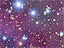 Six bright stars stand out in a field of many stars on a purple background