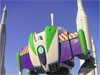 Toy figure Buzz Lightyear stands in front of rockets