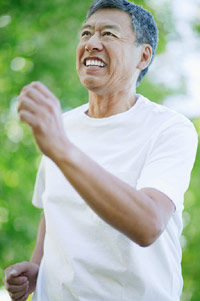 photo of asian man speed-walking