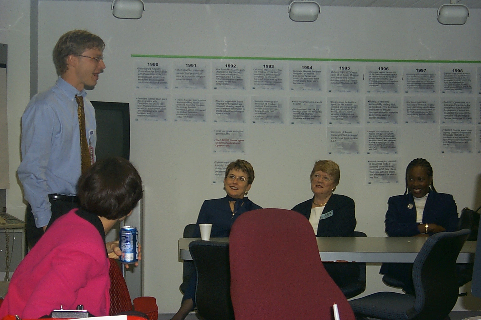 A man speaks to the crowd at the Open House