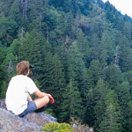 Hiker relaxing at overlook. Ken Voorhis photo.