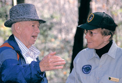 A volunteer reminisces with a park visitor.