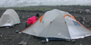 A July snow dusting tents in the Itkillik valley.