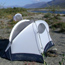 Tents on a gravel bar.