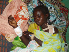Wounded IDP woman: A Sudanese girl recovers from injuries sustained during an attack on her community. GOS and GOS-supported Jingaweit militia have attacked civilians with impunity throughout Darfur.  USAID photo. 