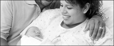 Photo: Parents with their newborn baby