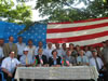 Ambassador Derse (front, center) and USAID's Yamashita (front, third from left) join Tazakand community leaders and guests to celebrate the inauguration of the villages new irrigation system which now supplies water to 20 hectares of orchards.