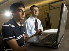 Dillon Patel, left, ponders computer modeling data with his NASA mentor, Pravin Aggarwal.