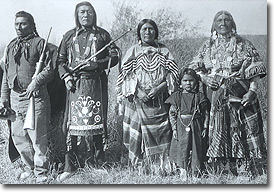 Historic photo of Native Americans in traditional dress.