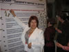Representatives of Oblast Health Authorities pin yellow-and-blue ribbons to the Commitment Banner to show their commitment to implementing effective perinatal practices in their regions during MIHP Dissemination Conference in September 2006