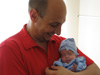 Baby Bohdan prepares to go home with his father