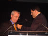 Brock D. Bierman, USAID's Chief of Staff for Europe & Eurasia Brock Bierman presents Harry Bajraktari with the Presidential Call to Service Award