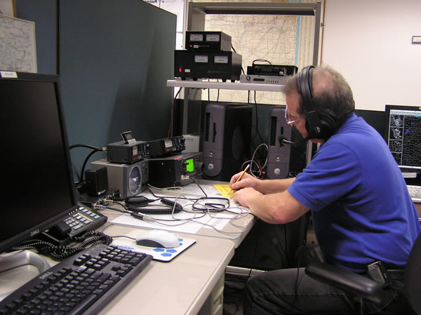 Phil Rittenhouse, NW9V, operating one of the HAM radios at the NWS