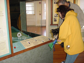 Visitors studying exhibits in Sandy Hook Lighthouse Keepers Quarters