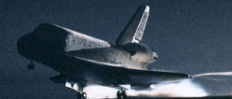 Discovery touches down for a night landing.