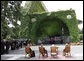 President George W. Bush and Mrs. Laura Bush join Pope Benedict XVI and Cardinal Tarcisio Bertone, Secretary of State, Vatican, as they watch a performance by The Pontifical Sistine Choir Friday, June 13, 2008, in the Lourdes Grotto at the Vatican. White House photo by Eric Draper