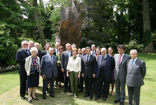President George W. Bush, Laura Bush, and members of the U.S. delegation, join French President Nicolas Sarkozy and members of the French delegation, for a group photo following the unveiling of the Flamme de la Liberte sculpture Saturday, June 14, 2008, at the U.S. Ambassador's residence in Paris. White House photo by Shealah Craighead